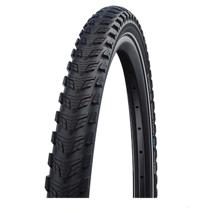 Black tire with tread pattern on a white background